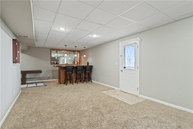 bar with visible vents, baseboards, carpet flooring, recessed lighting, and a bar