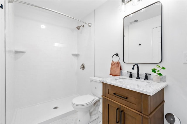 full bath with visible vents, toilet, vanity, and a tile shower