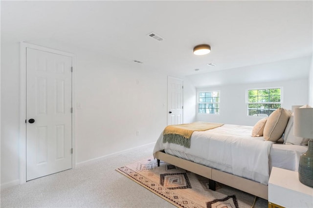 bedroom featuring visible vents, baseboards, and carpet flooring