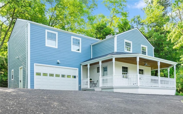 view of front of home featuring a porch and a garage