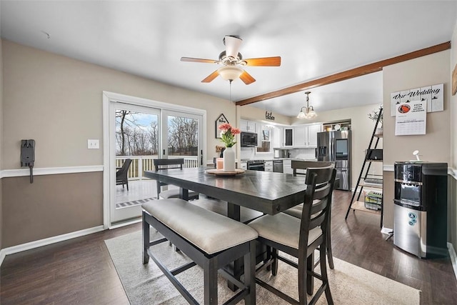 dining area with baseboards, dark wood finished floors, and a ceiling fan