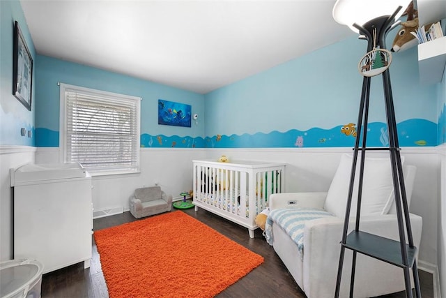 bedroom featuring visible vents and wood finished floors