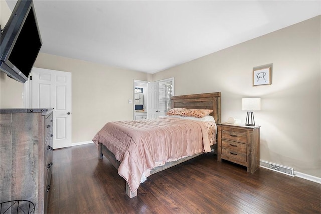 bedroom with visible vents, baseboards, and dark wood-type flooring