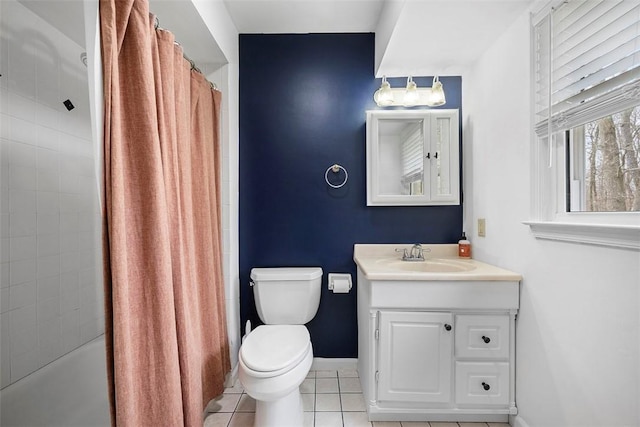 full bathroom with tile patterned floors, toilet, shower / bath combination with curtain, baseboards, and vanity