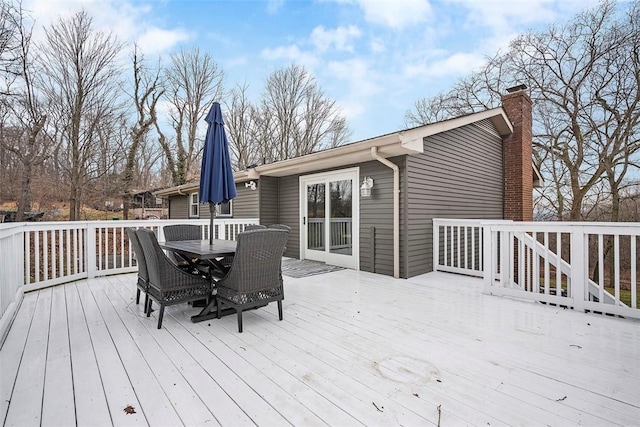 wooden terrace featuring outdoor dining space