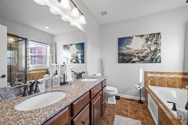 full bath featuring a sink, baseboards, a bath, and double vanity