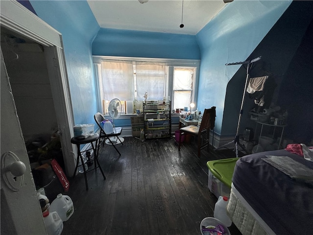 bedroom with hardwood / wood-style floors