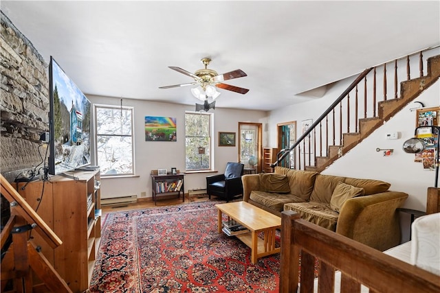 living room with a baseboard heating unit, wood finished floors, stairway, a baseboard radiator, and ceiling fan