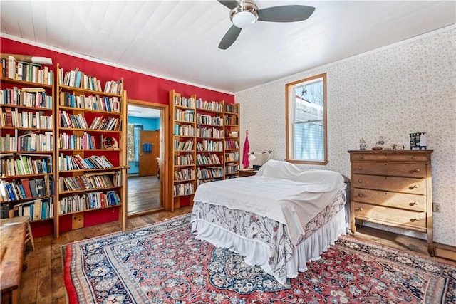 bedroom with hardwood / wood-style floors and wallpapered walls