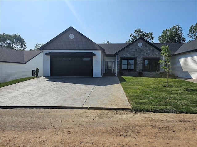 808 10th St, New Stanton, PA 15697 - single story home with a garage, driveway, a front yard, and stone siding