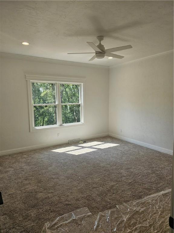 808 10th St, New Stanton, PA 15697 - carpeted empty room featuring crown molding and ceiling fan