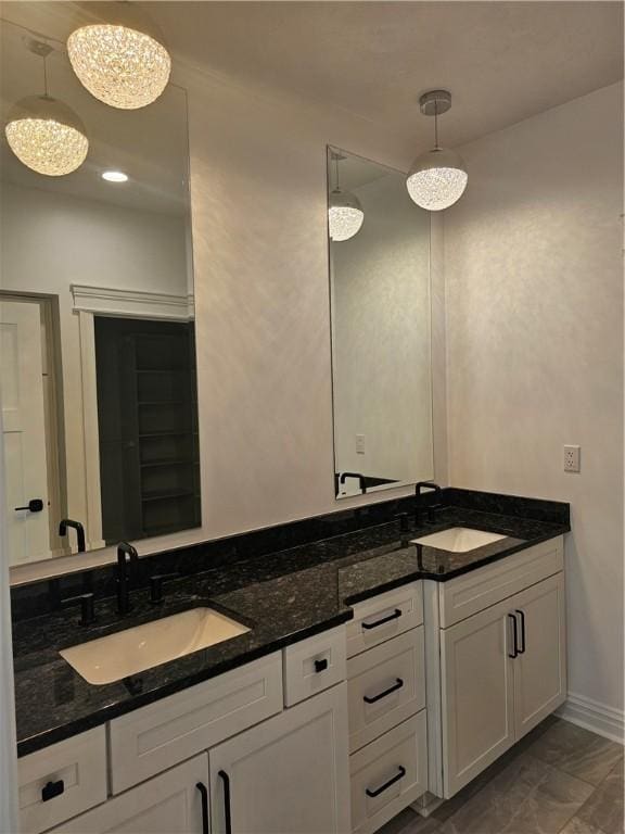 808 10th St, New Stanton, PA 15697 - bathroom with double vanity and baseboards
