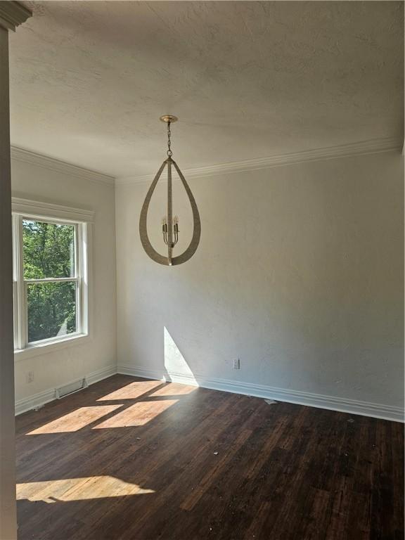 808 10th St, New Stanton, PA 15697 - unfurnished room featuring dark wood finished floors and ornamental molding