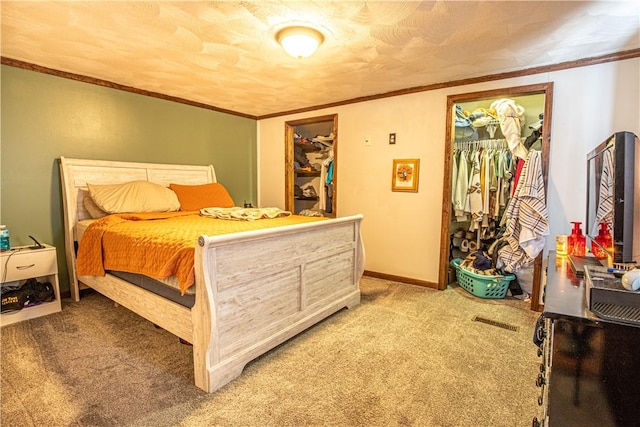 bedroom featuring visible vents, ornamental molding, a closet, baseboards, and light colored carpet