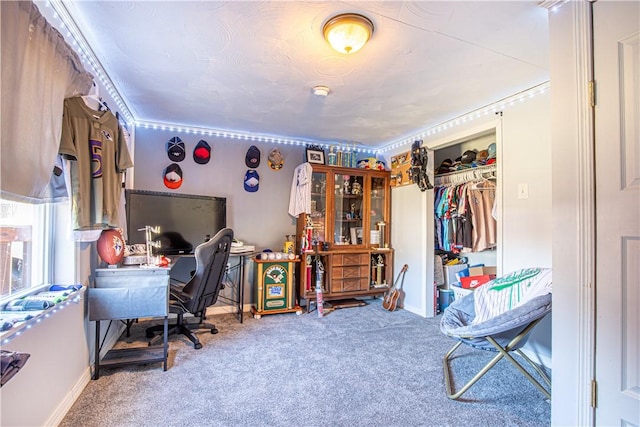 carpeted home office with baseboards