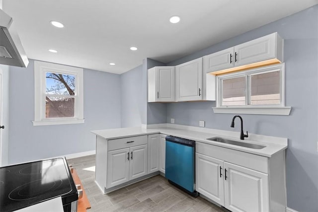 kitchen with electric range, a sink, a peninsula, white cabinets, and dishwashing machine