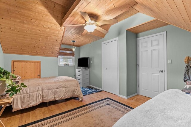 bedroom featuring light wood-style floors, baseboards, wood ceiling, ceiling fan, and vaulted ceiling