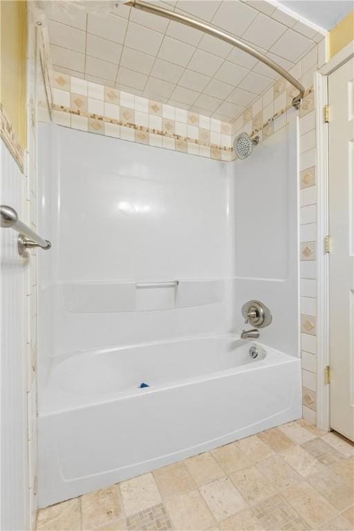 bathroom with shower / washtub combination