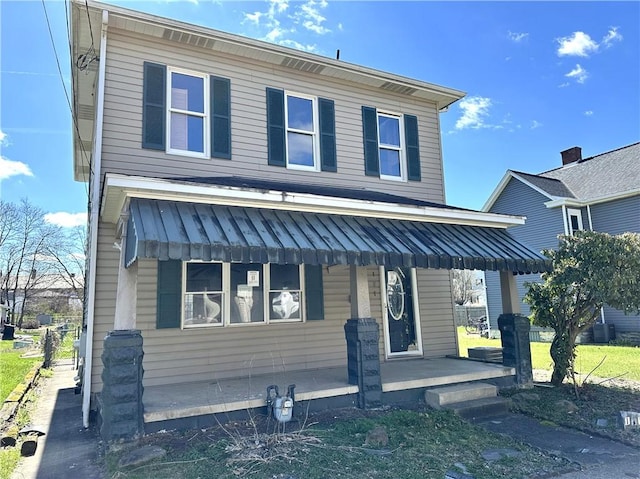 view of front of house featuring a porch and cooling unit