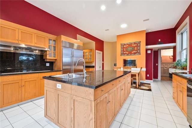 5435 Dunmoyle St, Squirrel Hill, PA 15217 - kitchen with appliances with stainless steel finishes, under cabinet range hood, light tile patterned floors, decorative backsplash, and recessed lighting