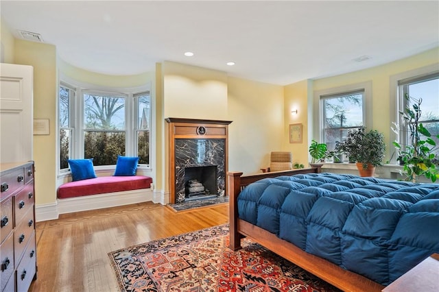 5435 Dunmoyle St, Squirrel Hill, PA 15217 - bedroom with light wood-type flooring, a high end fireplace, and recessed lighting