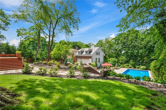 5435 Dunmoyle St, Squirrel Hill, PA 15217 - view of green lawn featuring an outdoor pool and view of wooded area