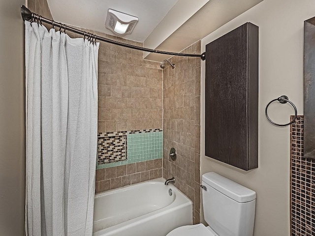 full bath featuring toilet and shower / bath combo with shower curtain