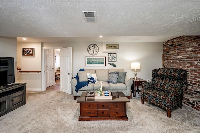 carpeted living room featuring visible vents, baseboards, and a textured ceiling