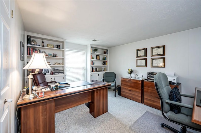 office space with visible vents and carpet floors