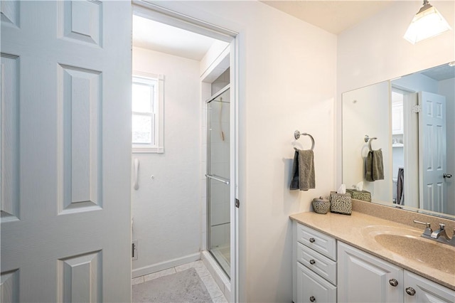 full bath with vanity and a stall shower