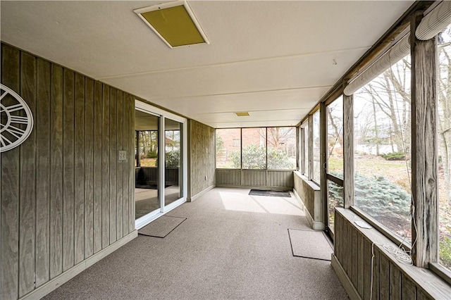 unfurnished sunroom with a wealth of natural light