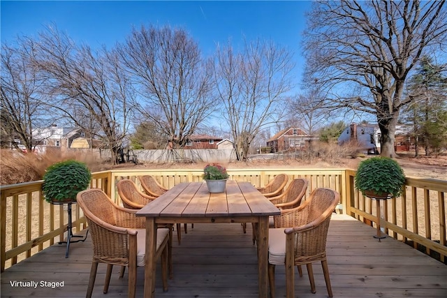 wooden terrace with outdoor dining area