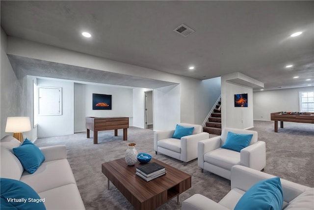 living area with carpet flooring, recessed lighting, stairway, and visible vents