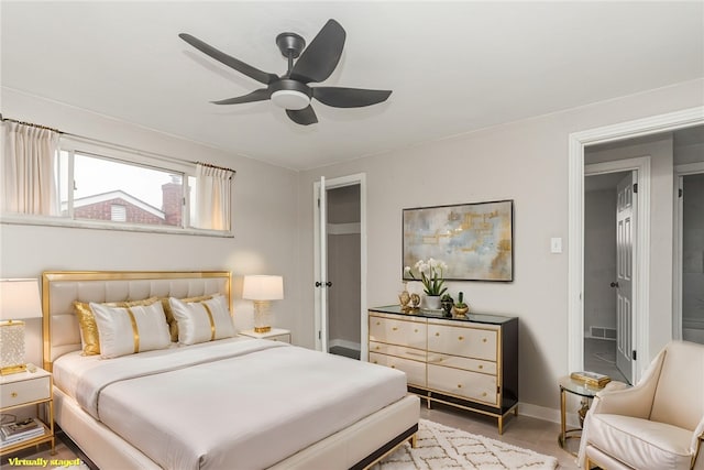 bedroom featuring ceiling fan and baseboards