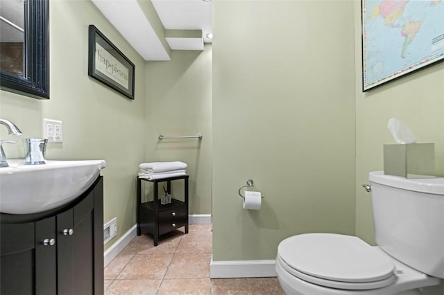 half bathroom featuring tile patterned floors, baseboards, and toilet