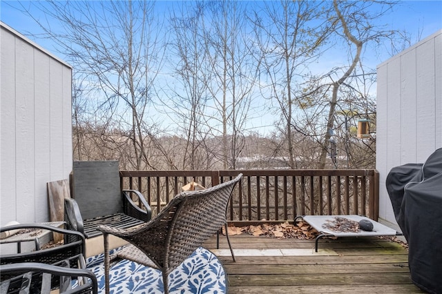 wooden terrace with a grill