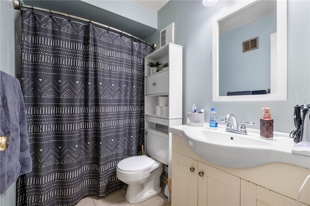 bathroom with visible vents, toilet, a shower with shower curtain, tile patterned flooring, and vanity