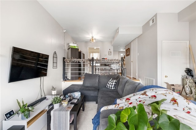 carpeted living room with visible vents