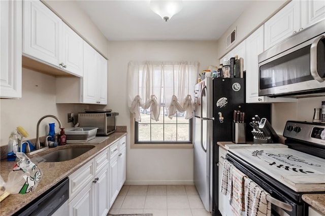 kitchen featuring white cabinetry, stainless steel appliances, and a sink