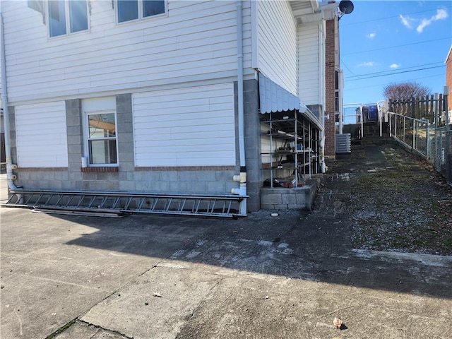 view of property exterior with fence