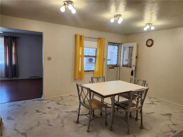 dining room with visible vents, baseboards, and marble finish floor