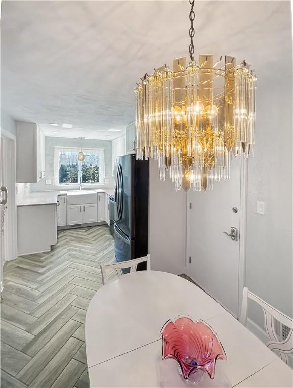 dining area featuring a notable chandelier