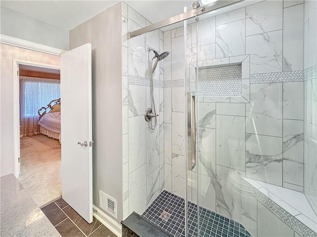 full bath with visible vents, connected bathroom, and a shower stall