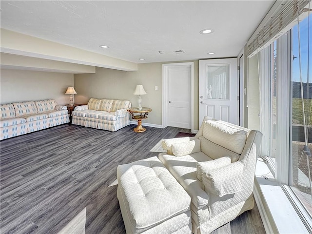 living room with visible vents, recessed lighting, baseboards, and wood finished floors