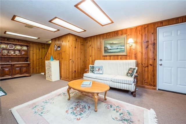 living room with wooden walls and carpet