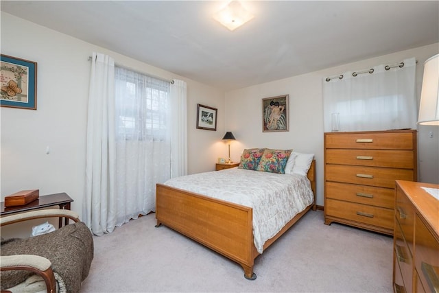 bedroom featuring light colored carpet