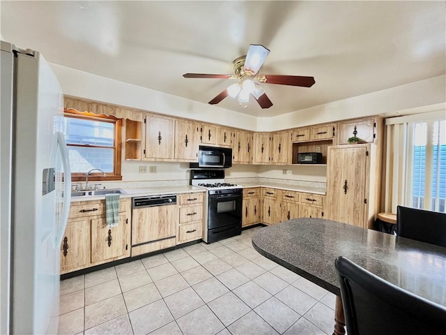 kitchen with black microwave, paneled dishwasher, white fridge with ice dispenser, gas stove, and a sink