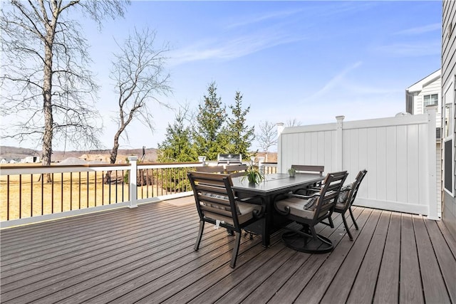 wooden deck with outdoor dining space