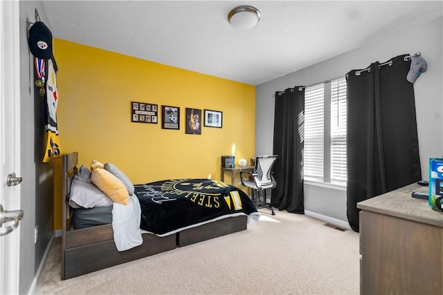 bedroom featuring visible vents, baseboards, and carpet floors