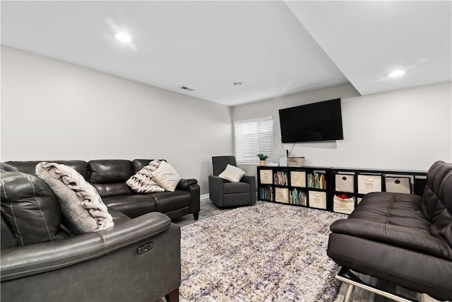 living area featuring recessed lighting and visible vents